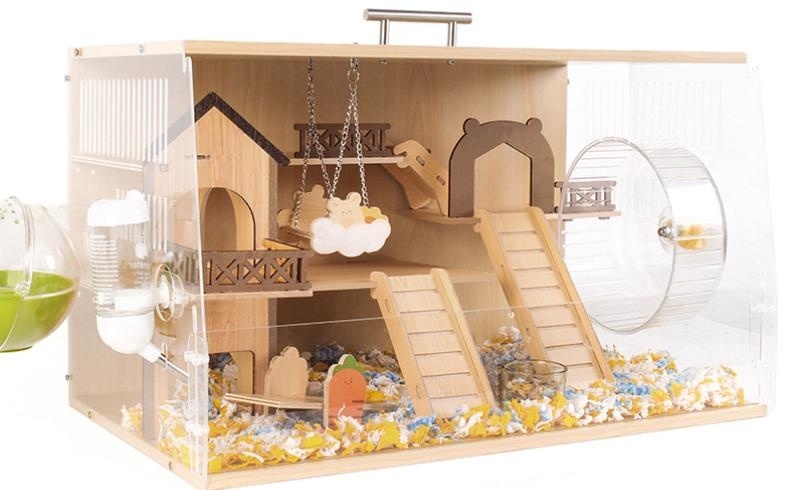 wooden hamster cage equipped with various toys