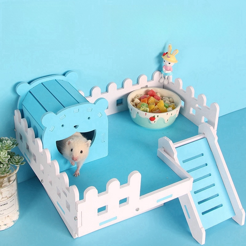 hamster in blue and wooden cage