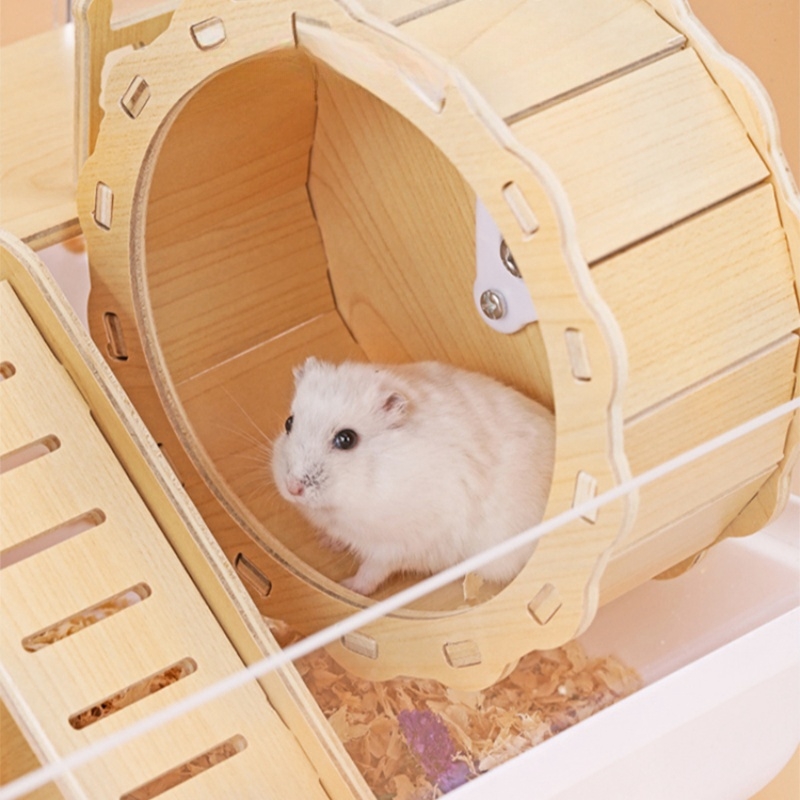 hamster in wooden wheel